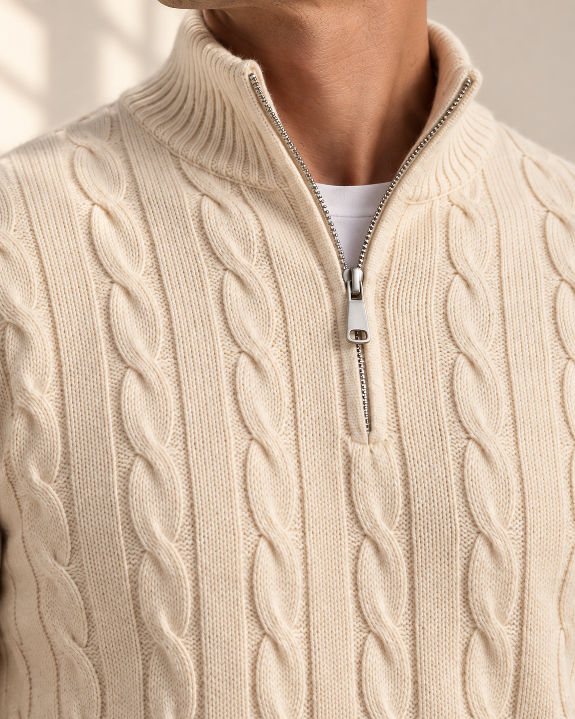 Macro material study of the Azul vaquero cable-jacquard mock neck, knit texture and short half-zip sweater