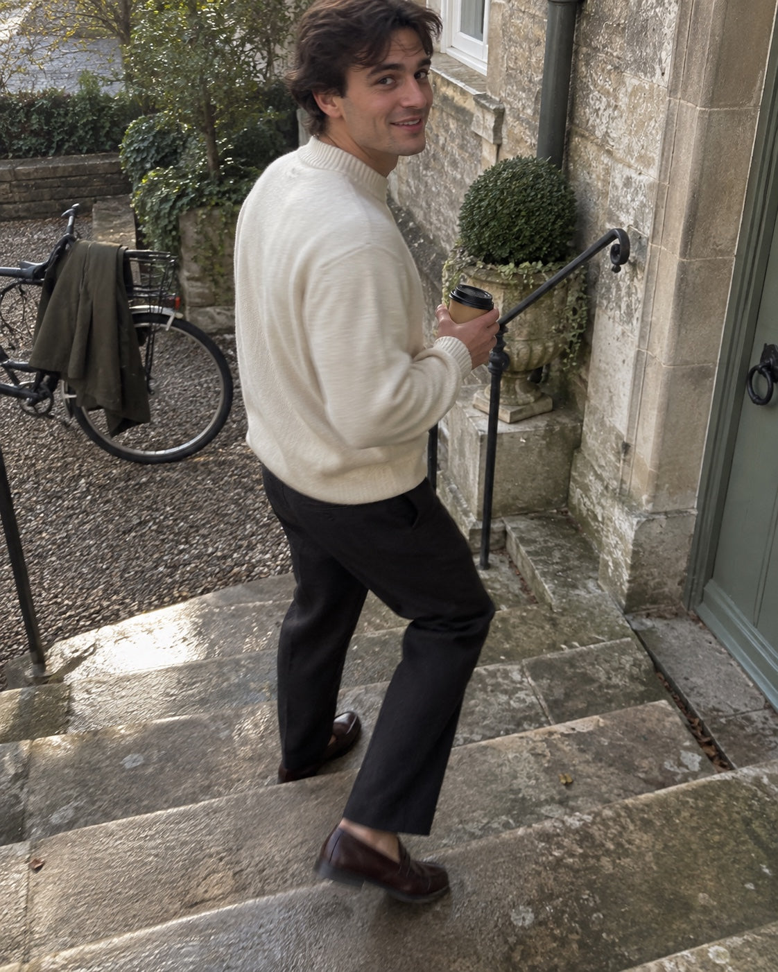 Customer wearing loafers on old stone steps